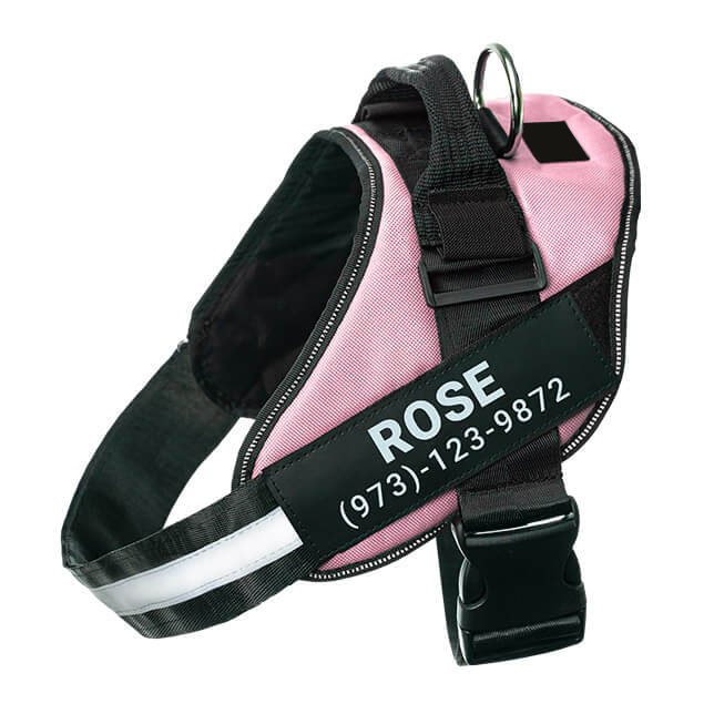 Pink no-pull dog harness with reflective strips – adjustable and comfortable fit.